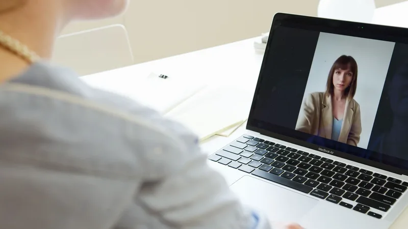 Person on a video call teaching an online session from a home office