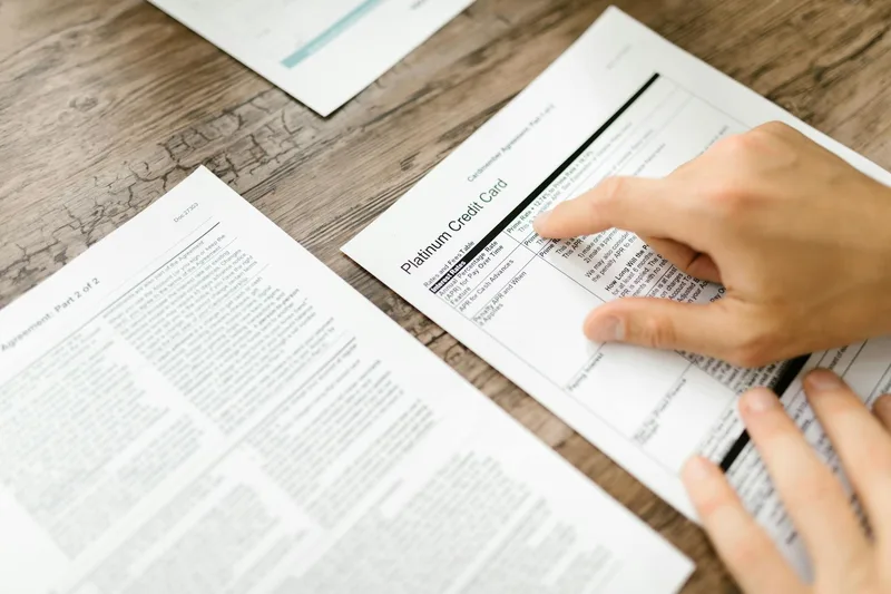 Person holding a printed document, reviewing the final output