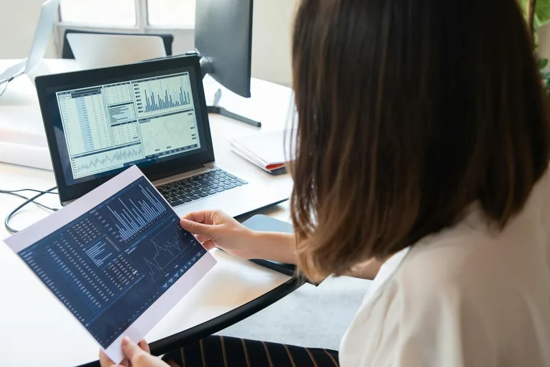 A person reviewing their Etsy shop analytics on a laptop