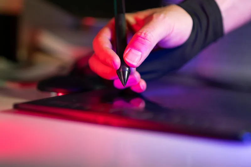 Digital sticker design process on a tablet with colorful design elements