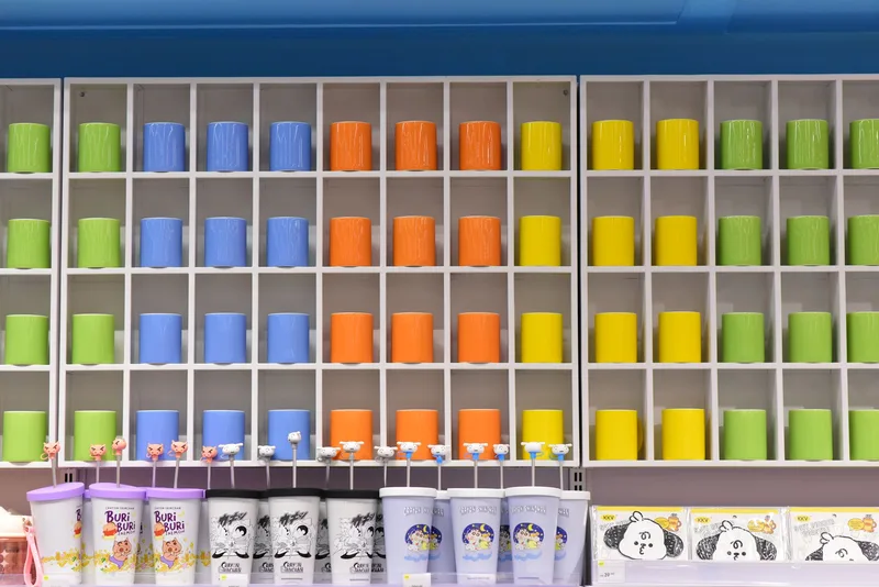 Organized sticker display with colorful product sheets in a well-lit studio
