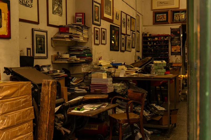 A print shop interior filled with framed artwork and prints for sale