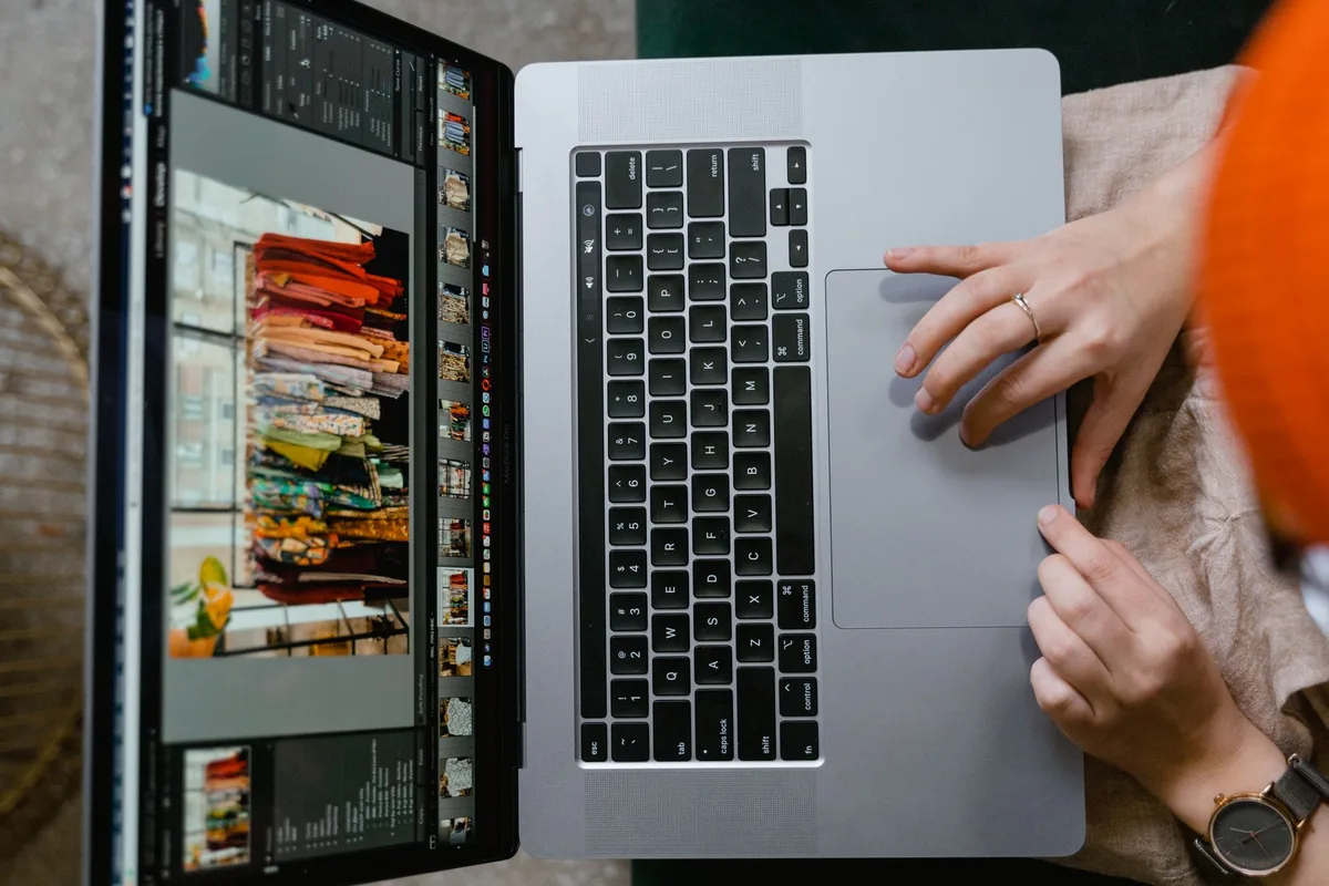 Creator reviewing online store options at a laptop