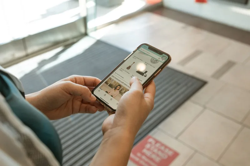 Community members browsing a marketplace-style storefront on a phone